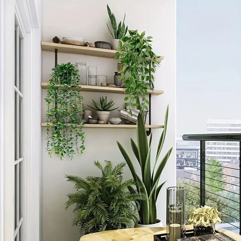 Set of four faux hanging plants arranged on a white wall for modern home decoration.