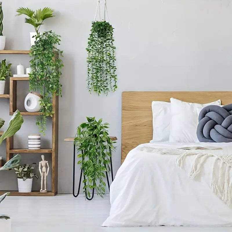 Artificial trailing greenery with long vines suitable for indoor and office decoration.